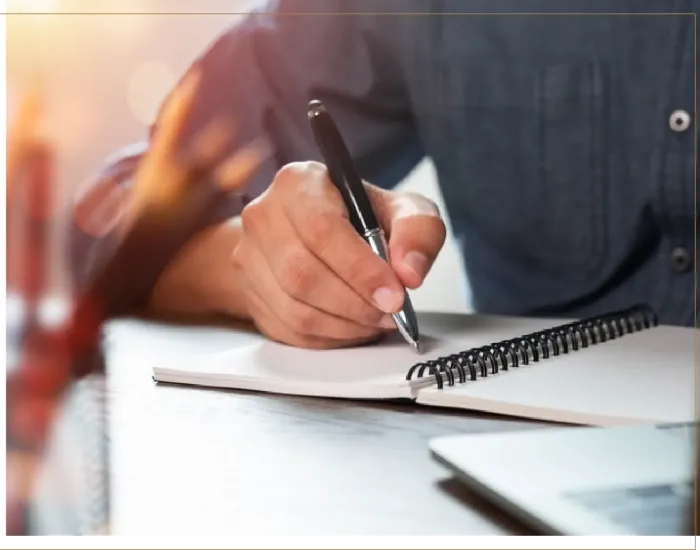 Man writing in notebook