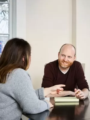 Two people in a tax meeting